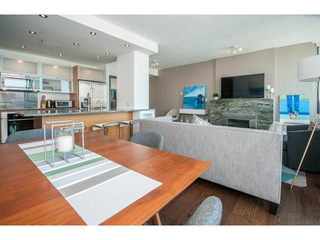 Modern kitchen with hardwood floors and city view. - 2404 - 1500 Hornby St, Vancouver Downtown