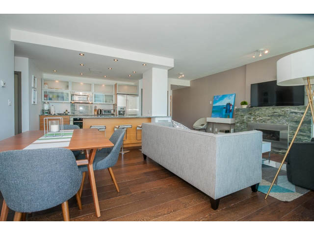 Furnished living room with hardwood floors and city view. - 2404 - 1500 Hornby St, Vancouver Downtown