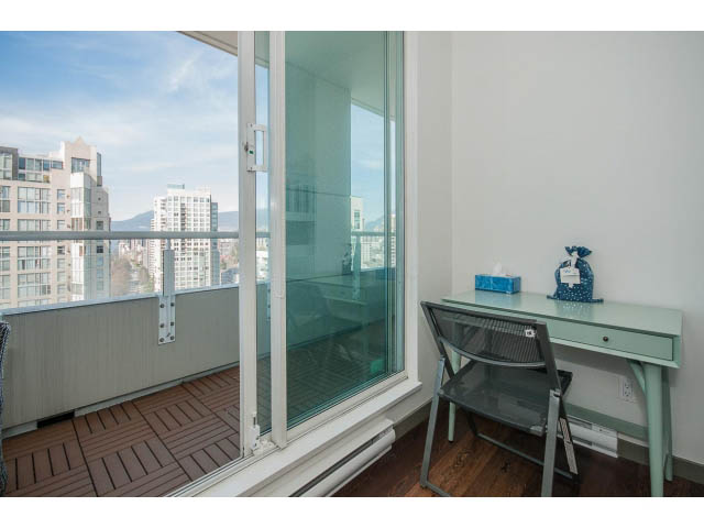 Bright living room with large glass door, hardwood floors, and city view. - 2404 - 1500 Hornby St, Vancouver Downtown