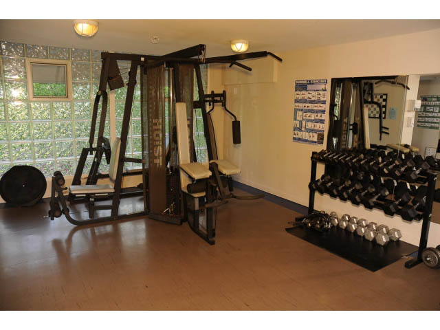 Furnished gym with weight racks and mirrors, hardwood floors. - 2404 - 1500 Hornby St, Vancouver Downtown