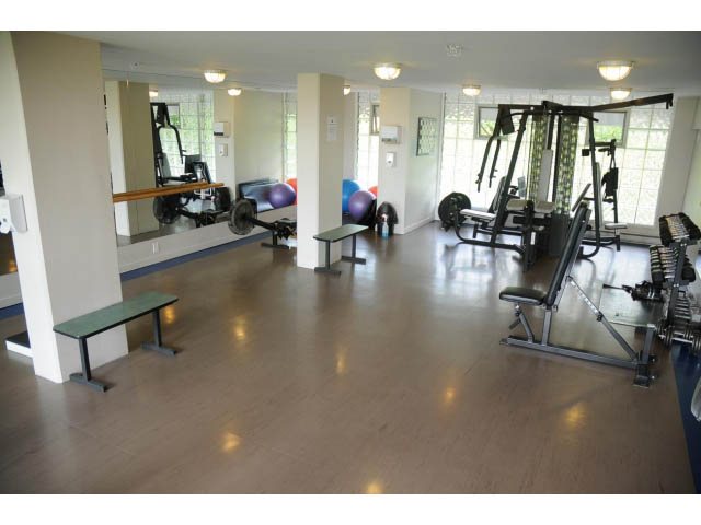 Spacious gym with hardwood floors, mirrors, and exercise equipment. - 2404 - 1500 Hornby St, Vancouver Downtown