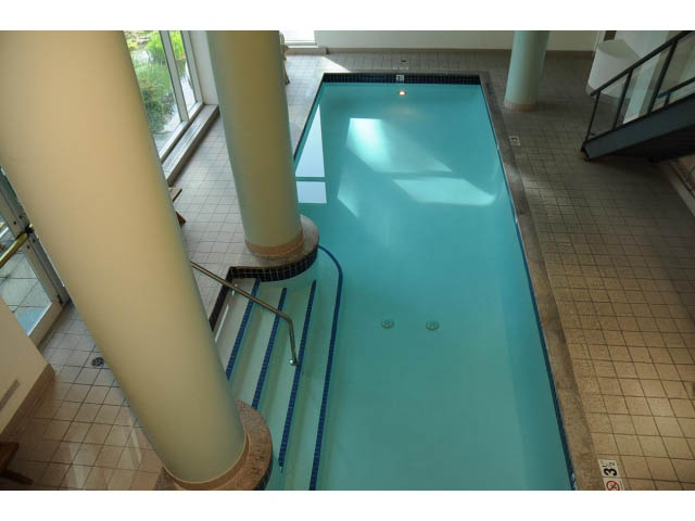 Spacious living room with large windows and tiled floors. - 2404 - 1500 Hornby St, Vancouver Downtown