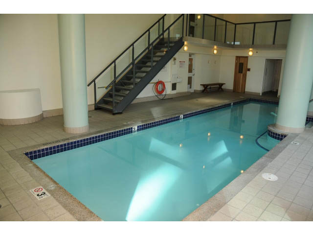 Spacious living room with large windows and modern decor. - 2404 - 1500 Hornby St, Vancouver Downtown