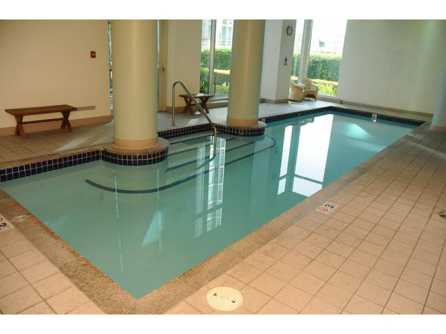 Spacious living room with large windows and tiled floor. - 2404 - 1500 Hornby St, Vancouver Downtown