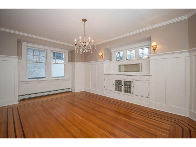 Bright living room with hardwood floors and white cabinetry. - 769 West 20th Ave, Vancouver West Side