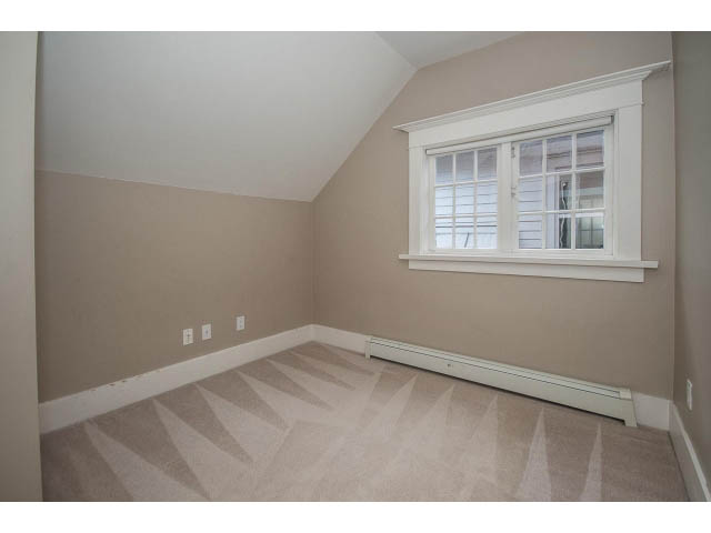Bright attic bedroom with carpeted floor and window. - 769 West 20th Ave, Vancouver West Side