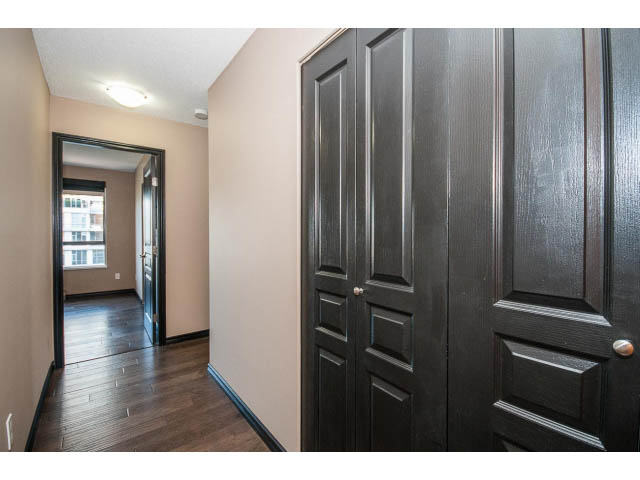 Furnished living room with dark wood cabinetry and hardwood floors. - 1808 - 1189 Howe St, Vancouver Downtown