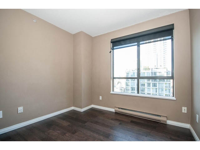 Bright living room with hardwood floors and city view. - 1808 - 1189 Howe St, Vancouver Downtown