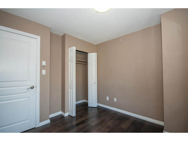 Bright living room with hardwood floors and a closet. - 1808 - 1189 Howe St, Vancouver Downtown
