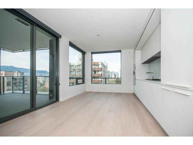 Bright living room with hardwood floors and city view. - 804 - 1171 Jervis St, Vancouver Downtown