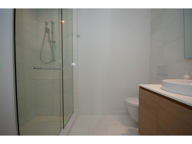 Bright bathroom with modern vanity and walk-in shower. - 804 - 1171 Jervis St, Vancouver Downtown