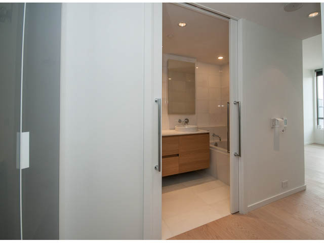 Bright bathroom with modern fixtures and glass shower doors. - 804 - 1171 Jervis St, Vancouver Downtown