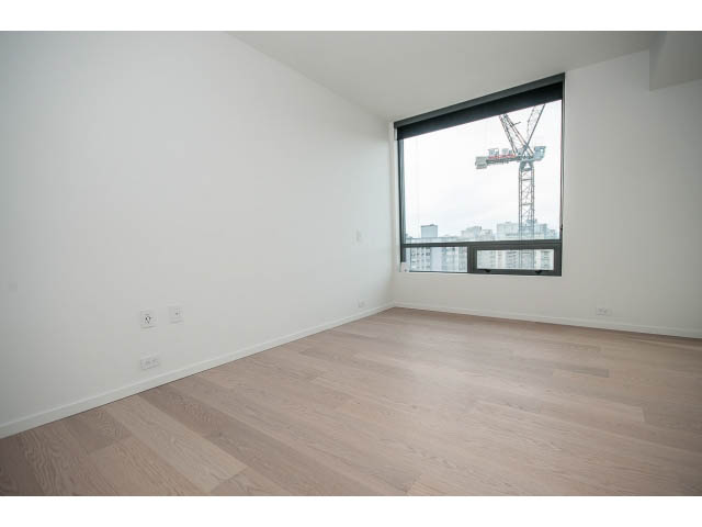 Bright living room with hardwood floors and city view. - 804 - 1171 Jervis St, Vancouver Downtown