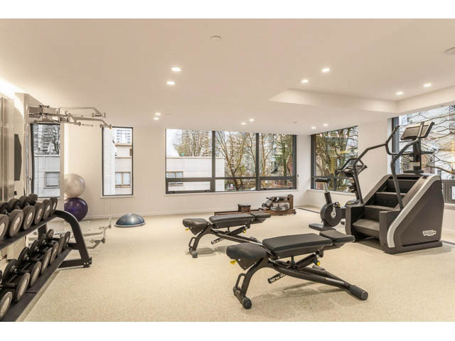 Spacious, well-lit gym with cardio equipment and large windows offering a city view. - 804 - 1171 Jervis St, Vancouver Downtown
