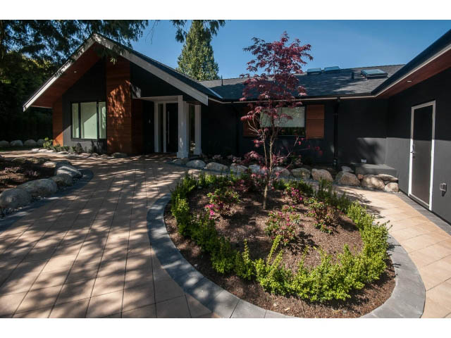 Furnished living room with modern decor and large windows. - 5235 Headland Dr., West Vancouver