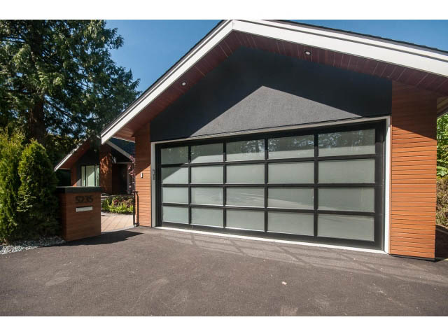 Furnished 5-bedroom house with modern design, large windows, and a spacious driveway. - 5235 Headland Dr., West Vancouver