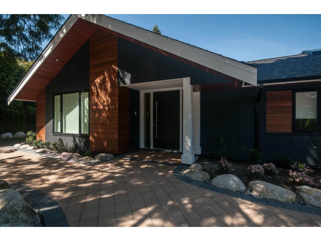 Bright entrance with modern design, wooden accents, and large windows. - 5235 Headland Dr., West Vancouver