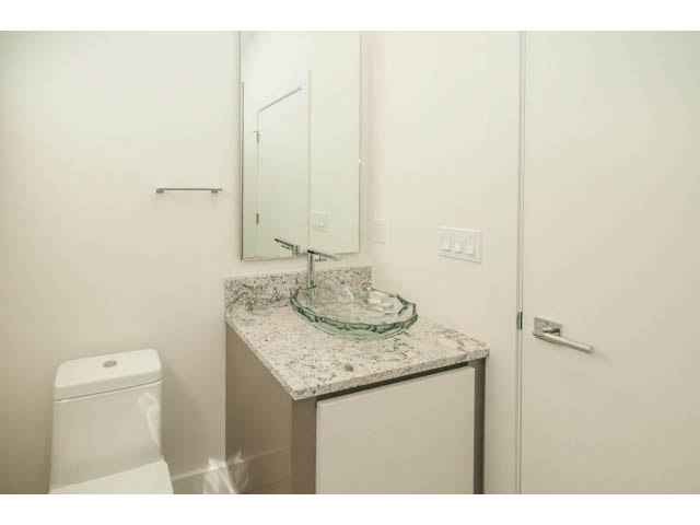 Bright bathroom with granite countertops and modern fixtures. - 5235 Headland Dr., West Vancouver