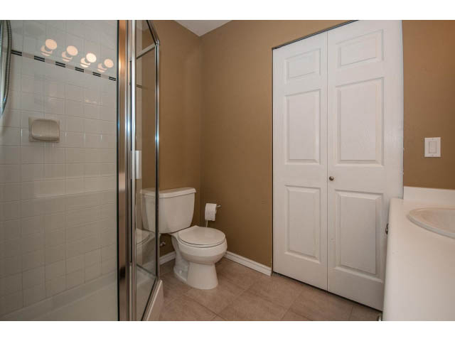 Bright bathroom with white fixtures and beige walls. - 204 - 630 Roche Point Drive, North Vancouver
