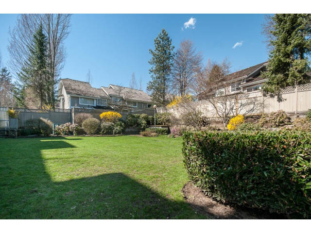 Furnished living room with cozy corner and greenery. - 204 - 630 Roche Point Drive, North Vancouver