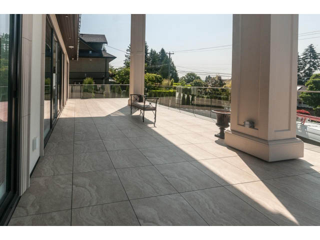 Furnished patio with large columns and city view. - 2333 Mathers Ave, West Vancouver