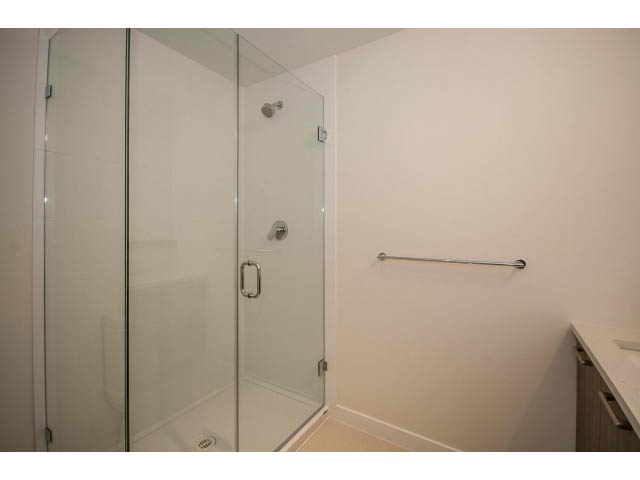 Furnished bathroom with glass shower and modern fixtures. - 303 - 615 East 3rd Street, North Vancouver