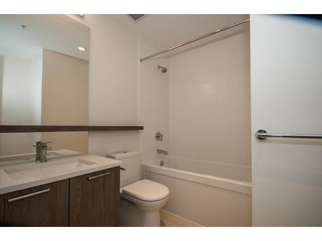 Furnished bathroom with white countertop and modern fixtures. - 303 - 615 East 3rd Street, North Vancouver