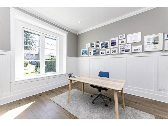Bright home office with white paneling, hardwood floors, and a city view. - 3075 Dryden Way, North Vancouver