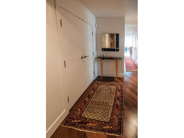 Furnished entryway with wooden floors and patterned rug; modern decor. - 1902 - 1111 Alberni Street, Vancouver Downtown