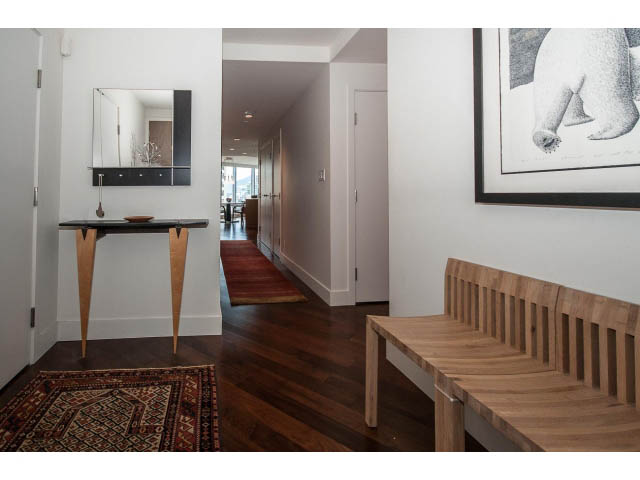 Furnished entryway with wooden floors, modern console table, and abstract artwork. - 1902 - 1111 Alberni Street, Vancouver Downtown