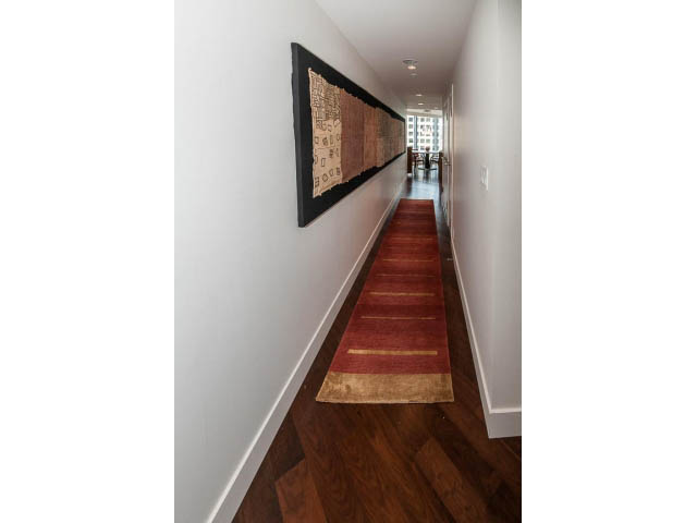 Furnished hallway with hardwood floors and a patterned rug. - 1902 - 1111 Alberni Street, Vancouver Downtown
