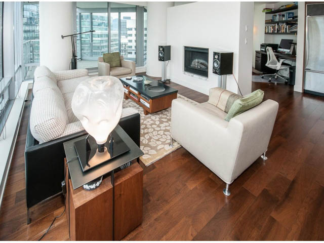 Bright living room with hardwood floors, city view, and modern furniture. - 1902 - 1111 Alberni Street, Vancouver Downtown
