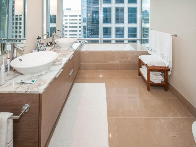Spacious bathroom with marble countertops, city view, and modern fixtures. - 1902 - 1111 Alberni Street, Vancouver Downtown