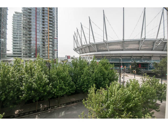 Furnished living room with city view and modern architecture. - 501 - 161 West Georgia St, Vancouver Downtown