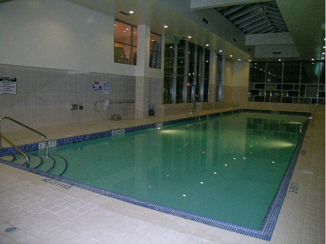 Spacious indoor pool area with tiled floors and modern design. - 501 - 161 West Georgia St, Vancouver Downtown
