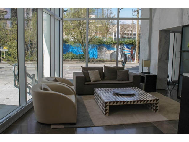 Furnished living room with large windows, modern furniture, and city view. - 501 - 161 West Georgia St, Vancouver Downtown
