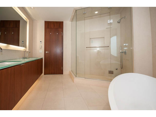 Spacious bathroom with glass shower and modern vanity. - 1502- 1560 Homer Mews, Vancouver Downtown