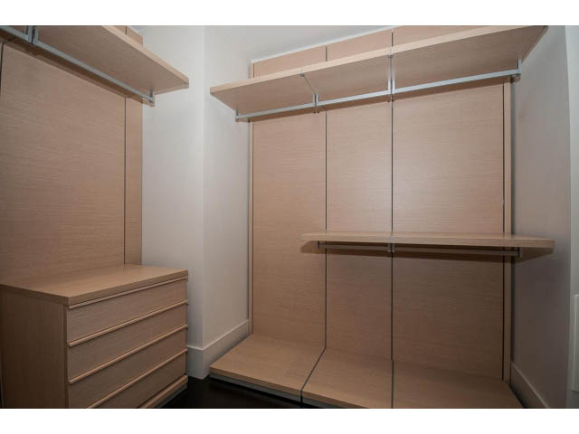 Furnished walk-in closet with wooden shelves and drawers. - 1502- 1560 Homer Mews, Vancouver Downtown