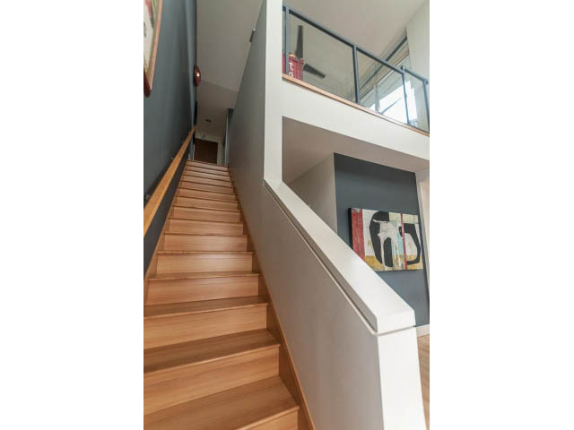 Bright loft with wooden stairs and modern railings. - 4123 - 2250 Commercial Dr, Vancouver East Side