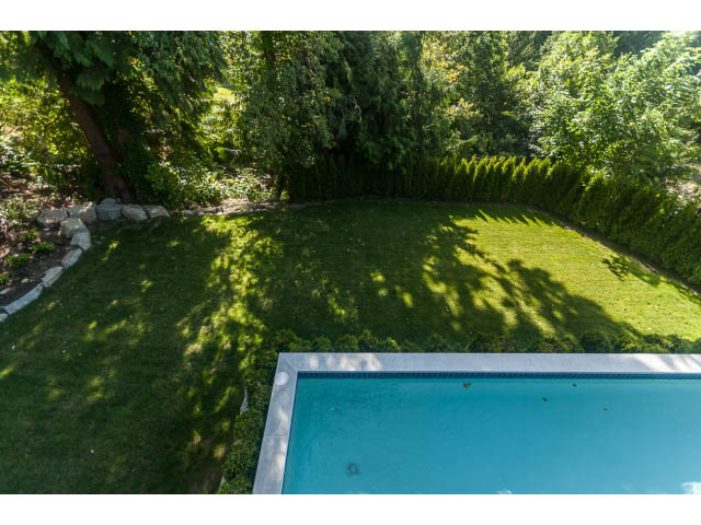 Furnished backyard with a pool and lush greenery. - 460 Hillcrest Street, West Vancouver