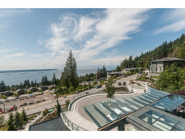 Bright living room with panoramic city view and modern glass balcony. - Suite # Withheld - 2958  Burfield Place, West Vancouver