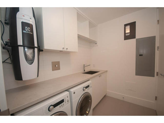 Bright laundry room with white cabinets and a modern washer/dryer setup. - Suite # Withheld - 2958  Burfield Place, West Vancouver