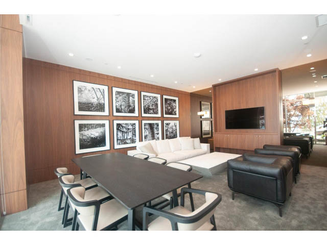 Furnished dining area with wooden walls, black and white artwork, and modern furniture. - Suite # Withheld - 2958  Burfield Place, West Vancouver