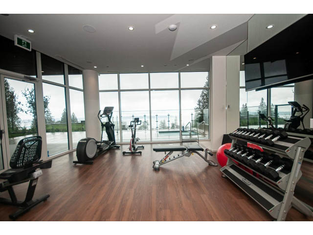 Spacious gym with hardwood floors, large windows, and city view. - Suite # Withheld - 2958  Burfield Place, West Vancouver