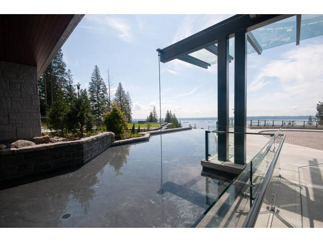 Spacious living room with panoramic lake view and glass walls. - Suite # Withheld - 2958  Burfield Place, West Vancouver