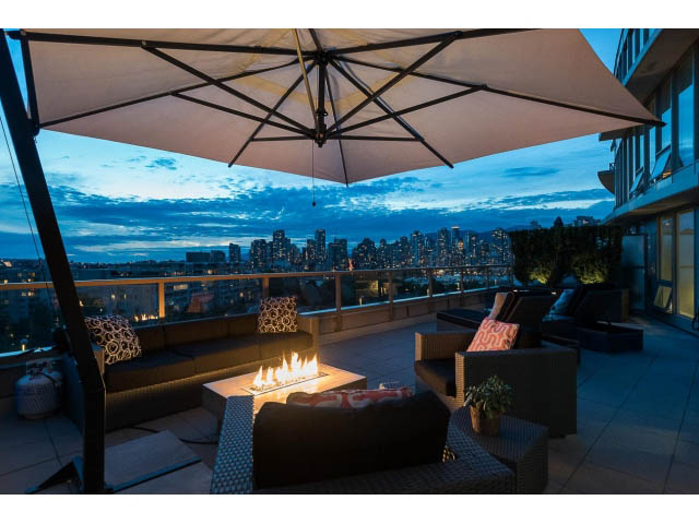 Furnished living room with a city view and outdoor fire pit. - 1110 - 445 West 2nd Ave, Vancouver West Side