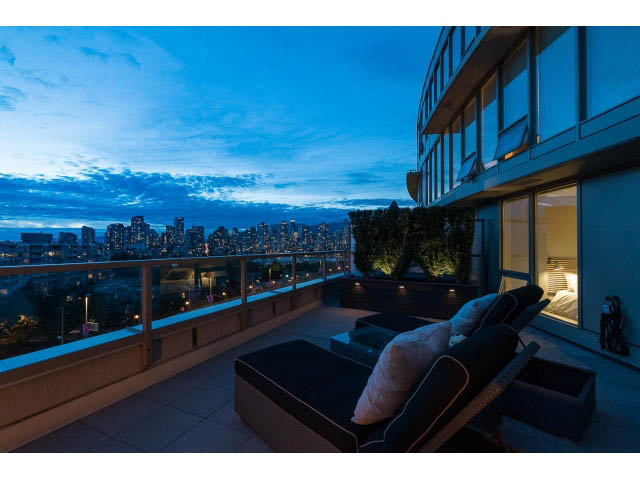 Furnished balcony with city view and lounge seating. - 1110 - 445 West 2nd Ave, Vancouver West Side