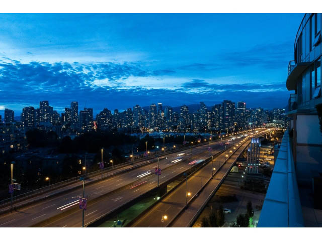 Furnished 1-bedroom with stunning city view at dusk. - 1110 - 445 West 2nd Ave, Vancouver West Side