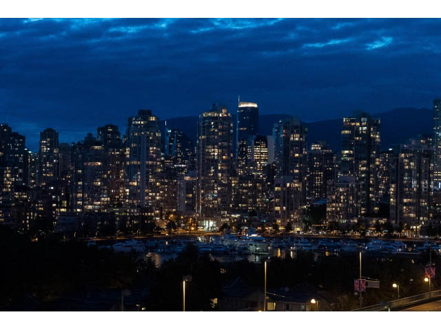Furnished 1-bedroom condo with stunning city view at dusk. - 1110 - 445 West 2nd Ave, Vancouver West Side
