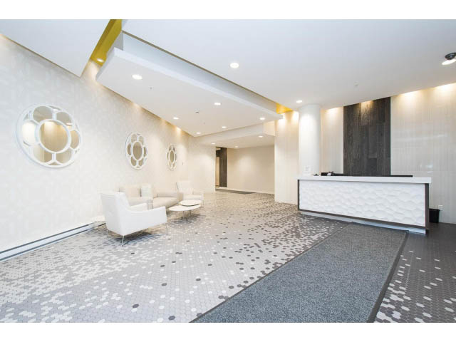Furnished living room with modern decor, white walls, and patterned tile floor. - 1110 - 445 West 2nd Ave, Vancouver West Side